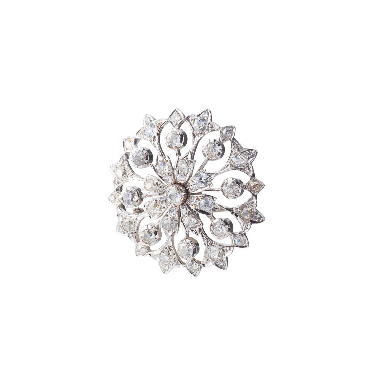 Elegant 1950s English brooch in 18ct gold with 4.5 carats of I-J colour SI clarity diamonds in an open floral motif.