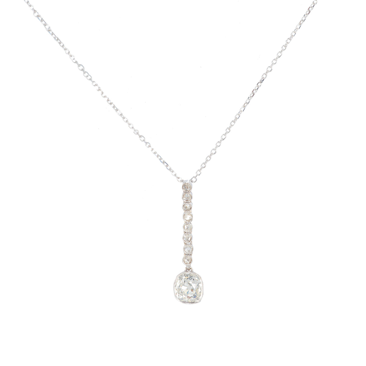 1960s old cut diamond pendant necklace in 18ct white gold with graduated drop design and articulated setting, made in England, 1.4 carats total.