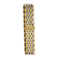 Side profile of vintage Cartier bracelet showing polished gold and steel rows and bracelet’s structured depth.