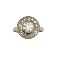 Front view of French Art Deco diamond target ring in platinum, featuring one carat centre diamond and halo of old cut diamonds, circa 1920s.