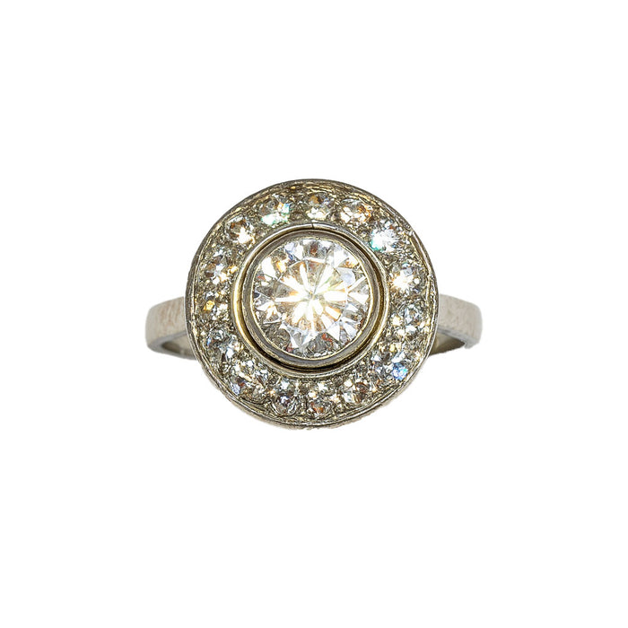 Front view of French Art Deco diamond target ring in platinum, featuring one carat centre diamond and halo of old cut diamonds, circa 1920s.