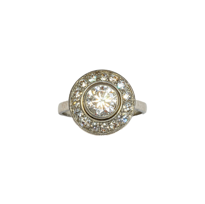 Front view of French Art Deco diamond target ring in platinum, featuring one carat centre diamond and halo of old cut diamonds, circa 1920s.