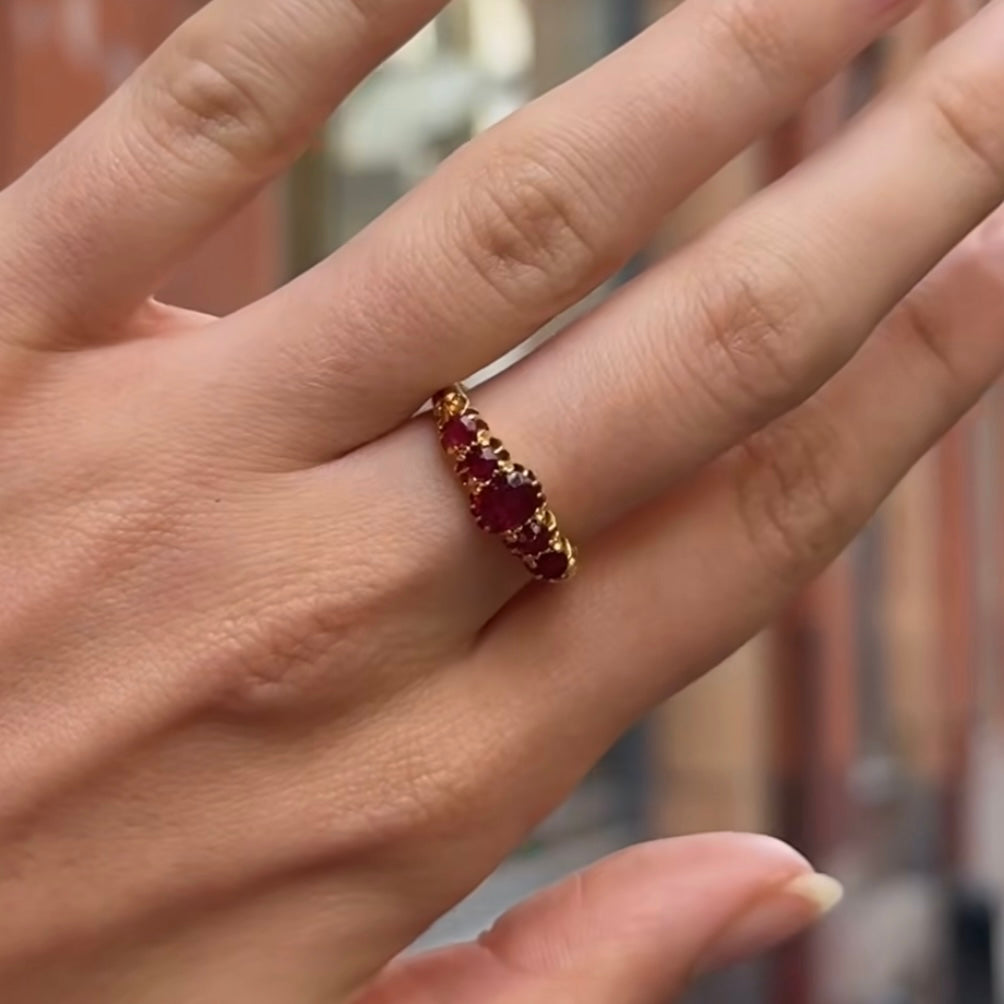 Antique 18ct gold ruby ring worn on hand, showcasing rich colour and Edwardian design