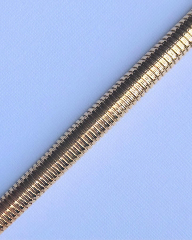 Detail of Tubogas necklace’s coiled gold structure, 18ct yellow gold finish