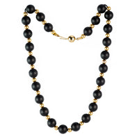 Vintage 1960s Italian necklace with alternating matte onyx and 14ct gold beads, laid flat