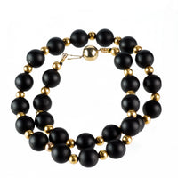 Close-up of 1960s Italian onyx and 14ct gold bead necklace showing contrast and clasp detail