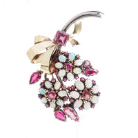 Front view of Dorrie Nossiter brooch showing almandine garnets and opals in floral cluster design, c.1920s