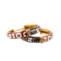 1950s European 18ct gold hoop earrings with red, black, and white enamel floral design laid flat