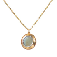 Rear view of 1880s gold locket showing locket compartment and antique patina