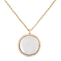 Antique Georgian pendant in gold with seed pearls and domed glass centre