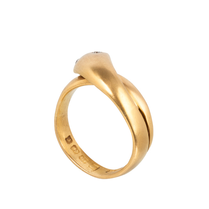 Back of antique 18ct gold Victorian snake ring with diamond eyes, hallmarked 1906, showing coiled serpent design and fine brushed gold texture.
