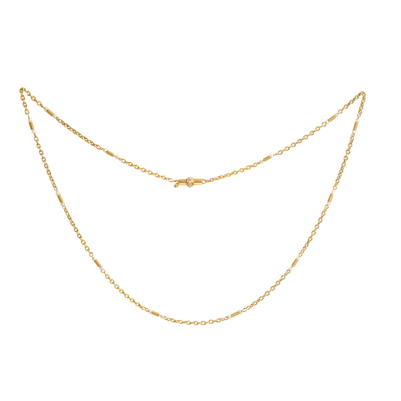 Antique English 15ct gold and pearl chain, circa 1900, featuring natural seed pearls and fine gold coiled detail with a pearl set barrel clasp.