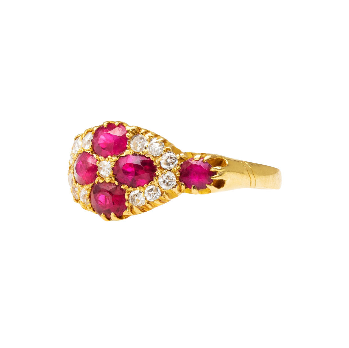 Side view of Edwardian 18ct gold Burmese ruby and diamond cluster ring, Chester 1914 hallmark, showing raised setting and detailed craftsmanship.