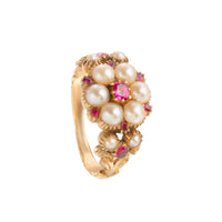 Front view of a Victorian 18ct gold ring set with natural pearls and vivid pink rubies in a raised floral cluster design, circa 1850s.