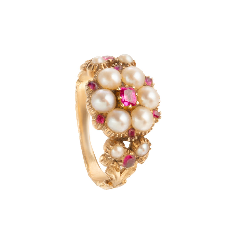 Front view of a Victorian 18ct gold ring set with natural pearls and vivid pink rubies in a raised floral cluster design, circa 1850s.