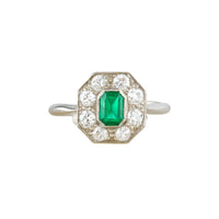 Art Deco emerald and diamond platinum ring from the 1930s, featuring an octagonal halo with old cut diamonds and a central step cut emerald.