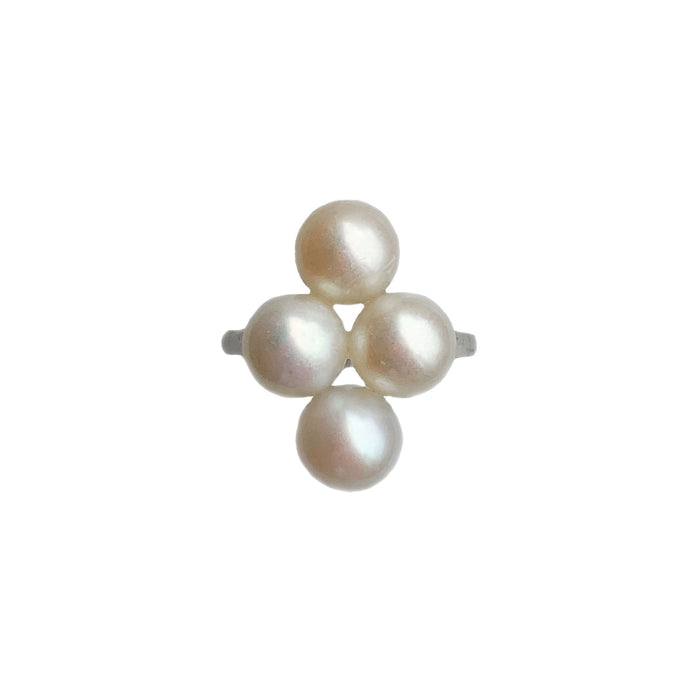 Art Deco platinum ring c.1920s set with four cultured pearls, English design hallmarked PT, front view.