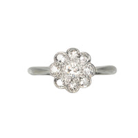 1950s daisy diamond cluster ring in 18ct white gold and platinum, old cut diamonds approx 0.50ct total, flowerhead design, front view.