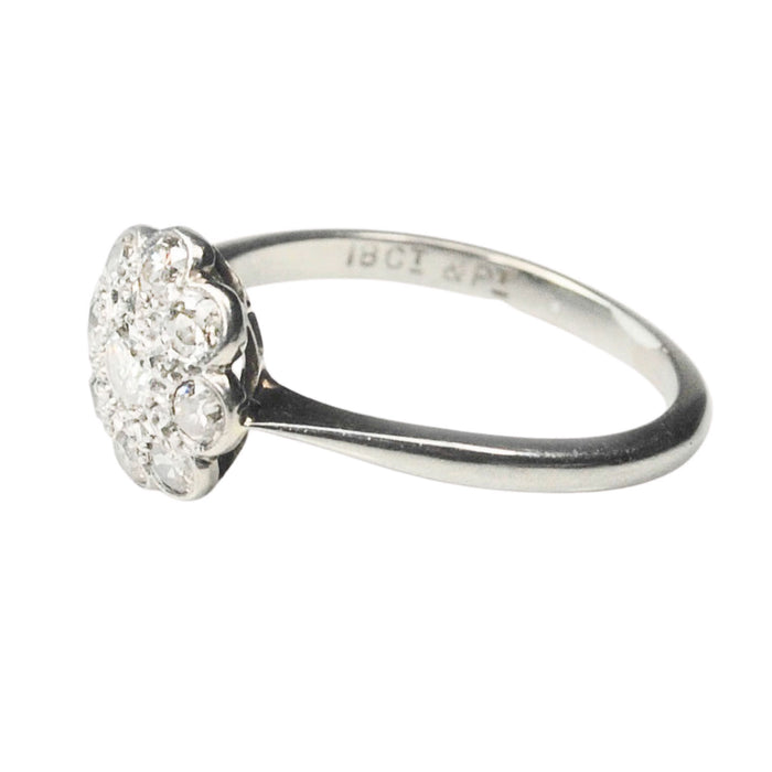Vintage British daisy diamond cluster ring c.1950s, platinum topped 18ct gold setting with 0.50ct old cut diamonds, side profile.