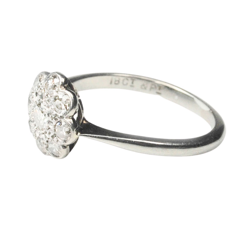 Vintage British daisy diamond cluster ring c.1950s, platinum topped 18ct gold setting with 0.50ct old cut diamonds, side profile.