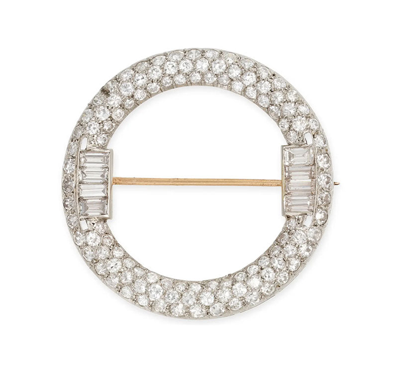 Art Deco diamond circle brooch with 4.42 carats of old European, single and baguette cut diamonds in platinum and 18ct gold, c. 1920s.