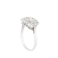 Side profile of 1940s platinum diamond cluster ring showing openwork under-gallery and scalloped diamond set edge.