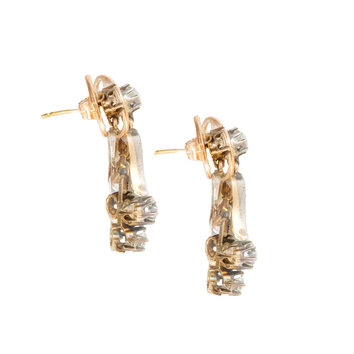 Side view of Edwardian Lily of the Valley diamond earrings, c.1910s, highlighting the tapered floral drops and silver topped 15ct gold settings with old cut diamonds.