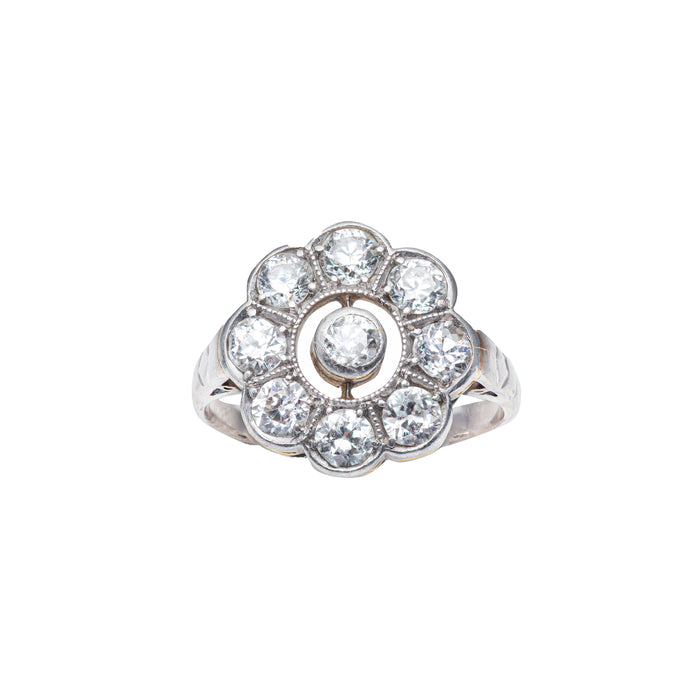 Antique Edwardian diamond daisy cluster ring with nine old cut diamonds set in platinum over 18ct gold, c.1900.