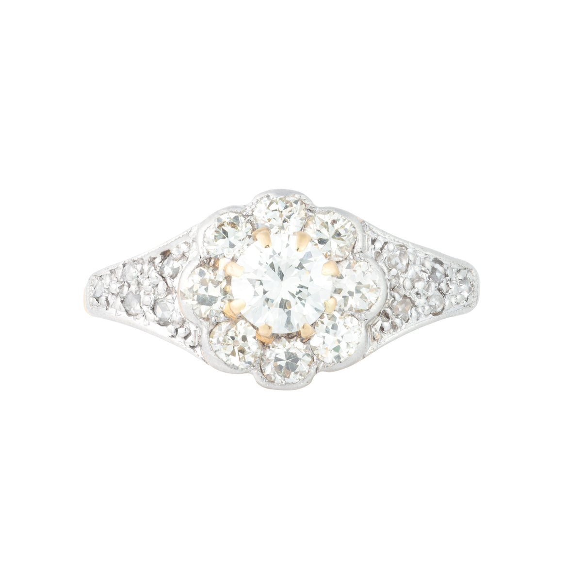 Edwardian diamond daisy cluster ring c.1910 with old cut diamonds totalling 1.10 carats, platinum mount and 18ct gold shank, front view.