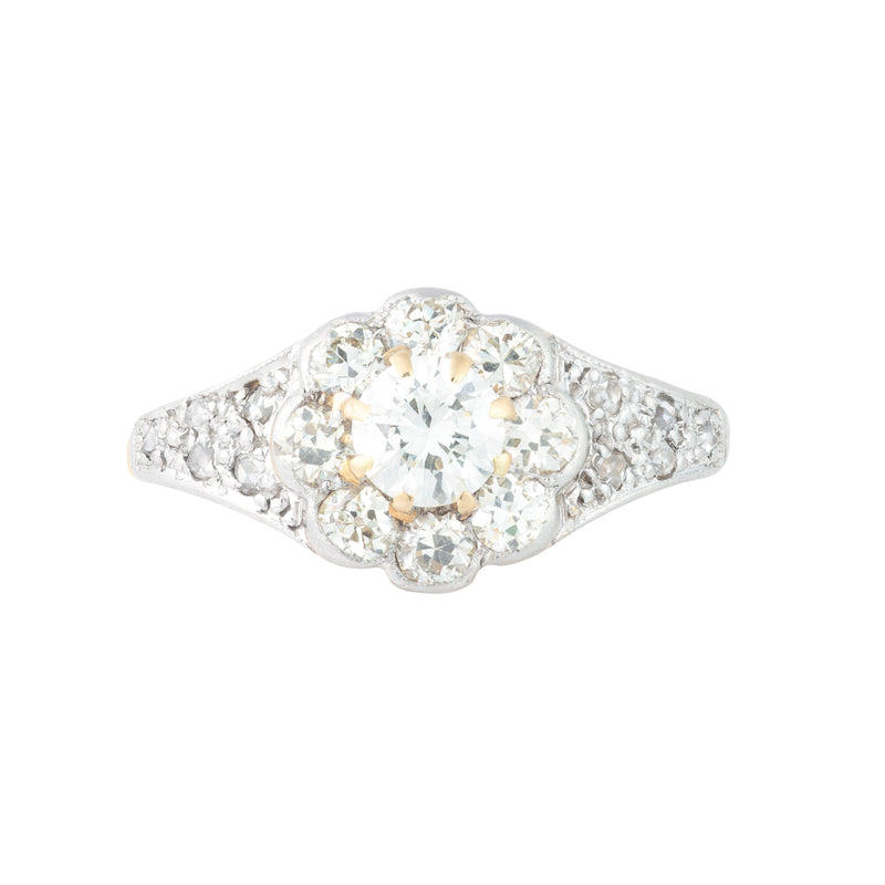 Edwardian diamond daisy cluster ring c.1910 with old cut diamonds totalling 1.10 carats, platinum mount and 18ct gold shank, front view.