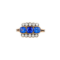 Art Deco sapphire and diamond rectangular ring in 18ct yellow gold with three Ceylon sapphires and old cut diamonds, English c.1920s, front view.