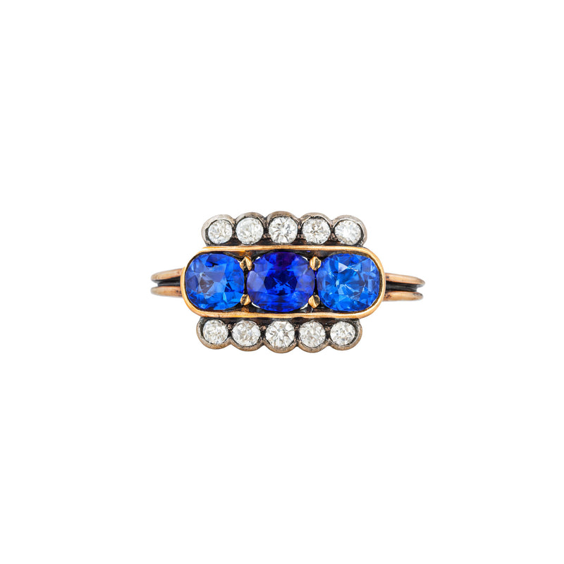 Art Deco sapphire and diamond rectangular ring in 18ct yellow gold with three Ceylon sapphires and old cut diamonds, English c.1920s, front view.