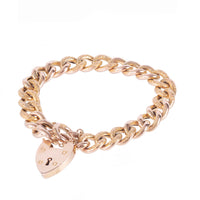 Edwardian 9ct gold curb bracelet, c.1910s, with alternating polished and textured links and original heart padlock clasp, shown from the front