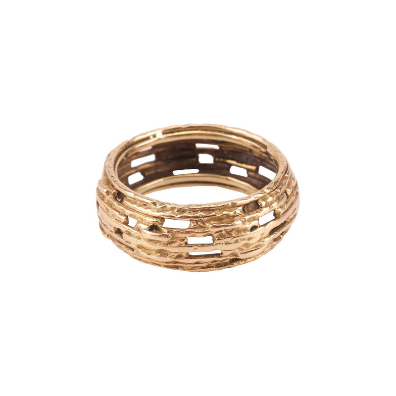 Side view of the 18ct gold openwork ring by Grima, highlighting the layered organic form and intricate craftsmanship.