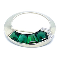 Close up front view of 1930s Gübelin brooch set with green tourmalines and diamonds in 18ct white gold circular mount.