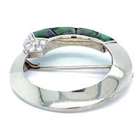 Reverse view of Gübelin 1930s tourmaline and diamond brooch, showing 18ct white gold circular frame and pin fitting.