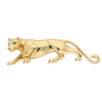Cartier gold panther brooch with emerald eyes