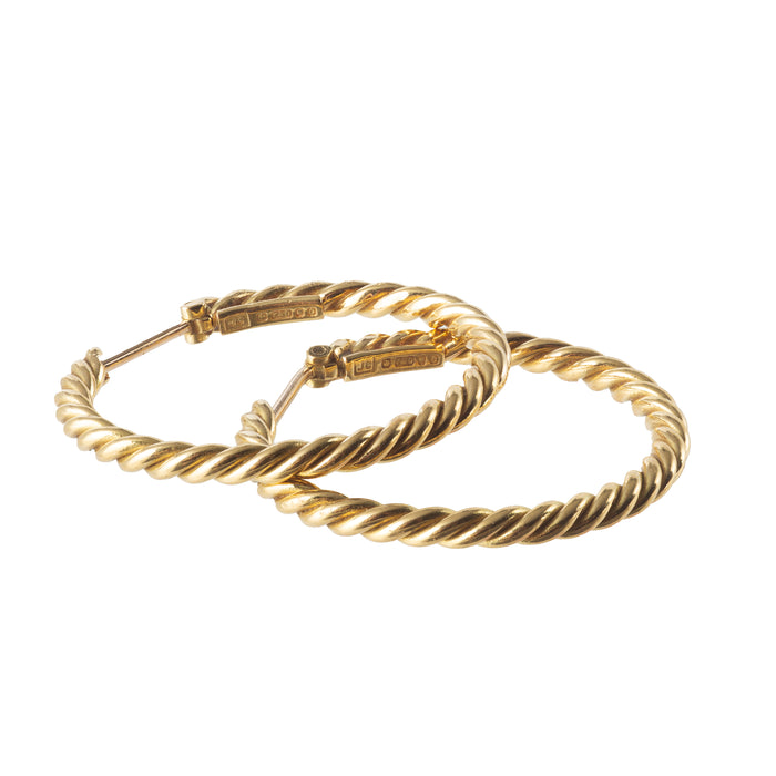 Cartier 1970s 18ct gold rope hoop earrings, laid flat.