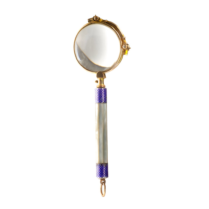 Closed view of 1920s gold filled lorgnettes with mother of pearl handle and blue enamel detail