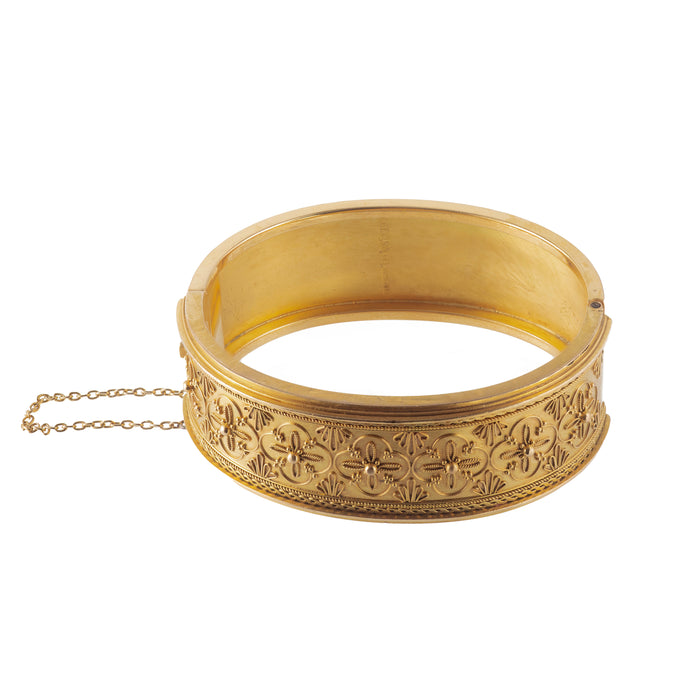 Antique 15ct gold bangle with rosette pattern and safety chain, Chester hallmark, 1867.