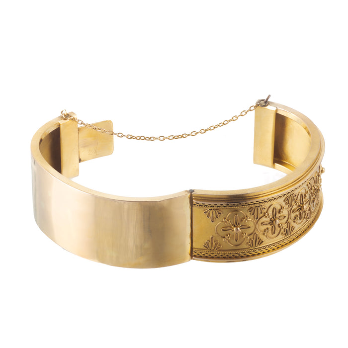 Open view of 15ct gold Victorian bangle with Etruscan Revival detail and hinge clasp.