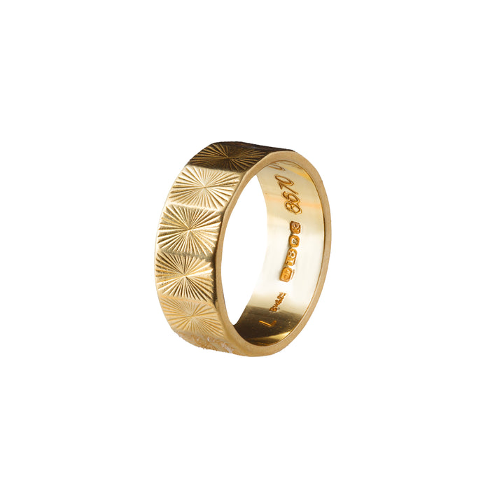 1960s British gold band ring with engraved sunburst design