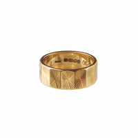Antique gold ring with geometric sunburst pattern
