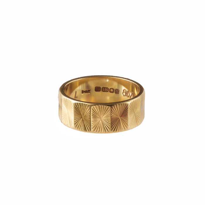 Antique gold ring with geometric sunburst pattern