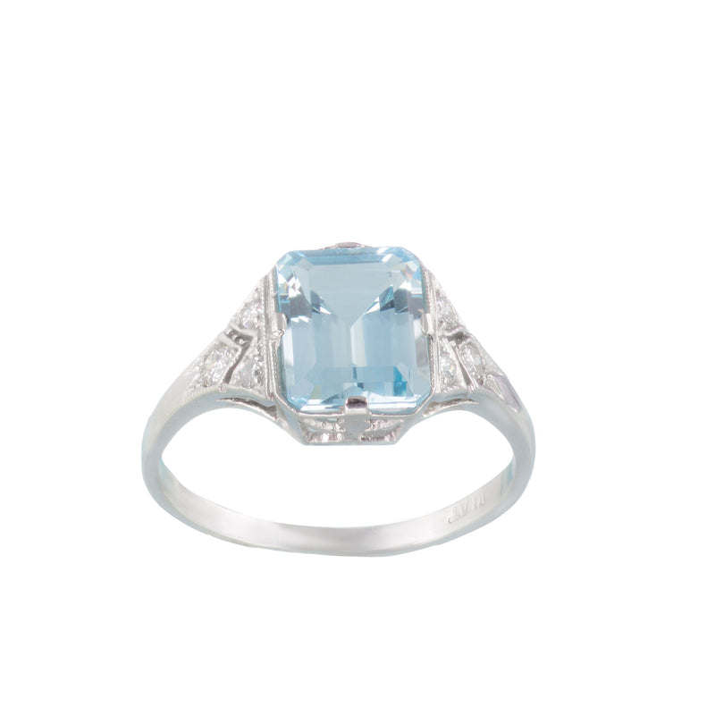 Front view of vintage 1950s platinum ring with 2.5ct emerald cut aquamarine and diamond shoulders in a millegrain setting, UK size N½.
