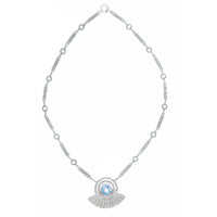 Theodor Fahrner Art Deco silver necklace from the 1930s, featuring a round blue spinel in a marcasite radiating fan design, shown on display.