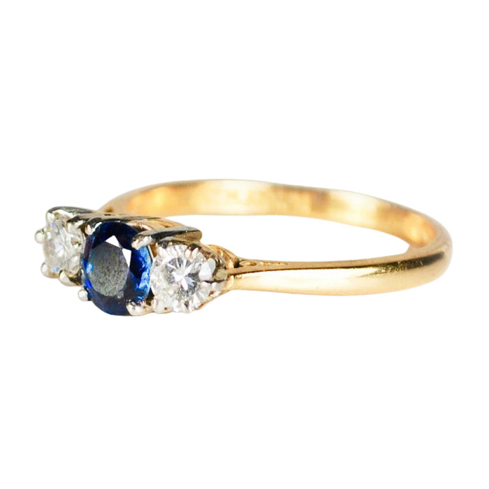 Mid century 18ct gold ring with sapphire and two diamonds set in platinum claws