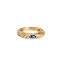 Cabochon sapphire ring set in fluted 18ct yellow gold with smooth bezel setting, London hallmark visible