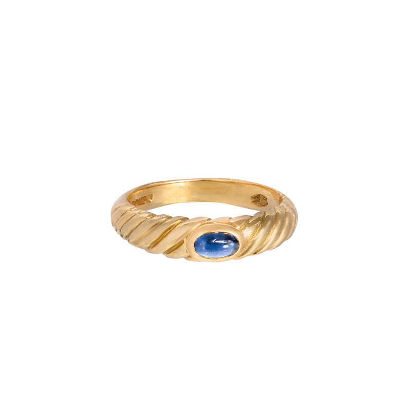Cabochon sapphire ring set in fluted 18ct yellow gold with smooth bezel setting, London hallmark visible
