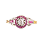 An Art Deco Diamond Target ring with Ruby halo